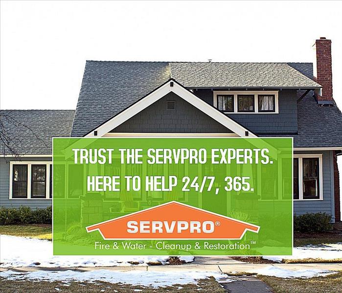 SERVPRO logo and information in front of house 